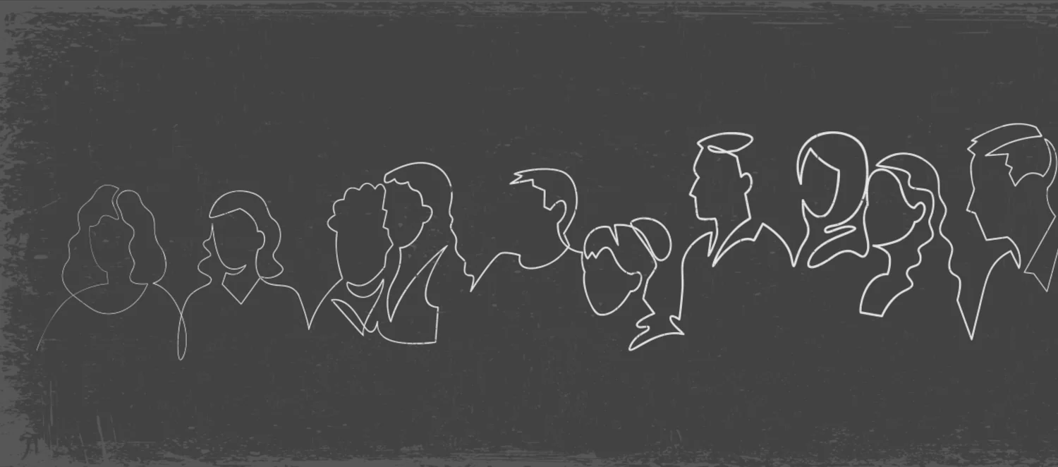 Eine Menschengruppe die nebeneinander stehen und in eine Richtung schauen.